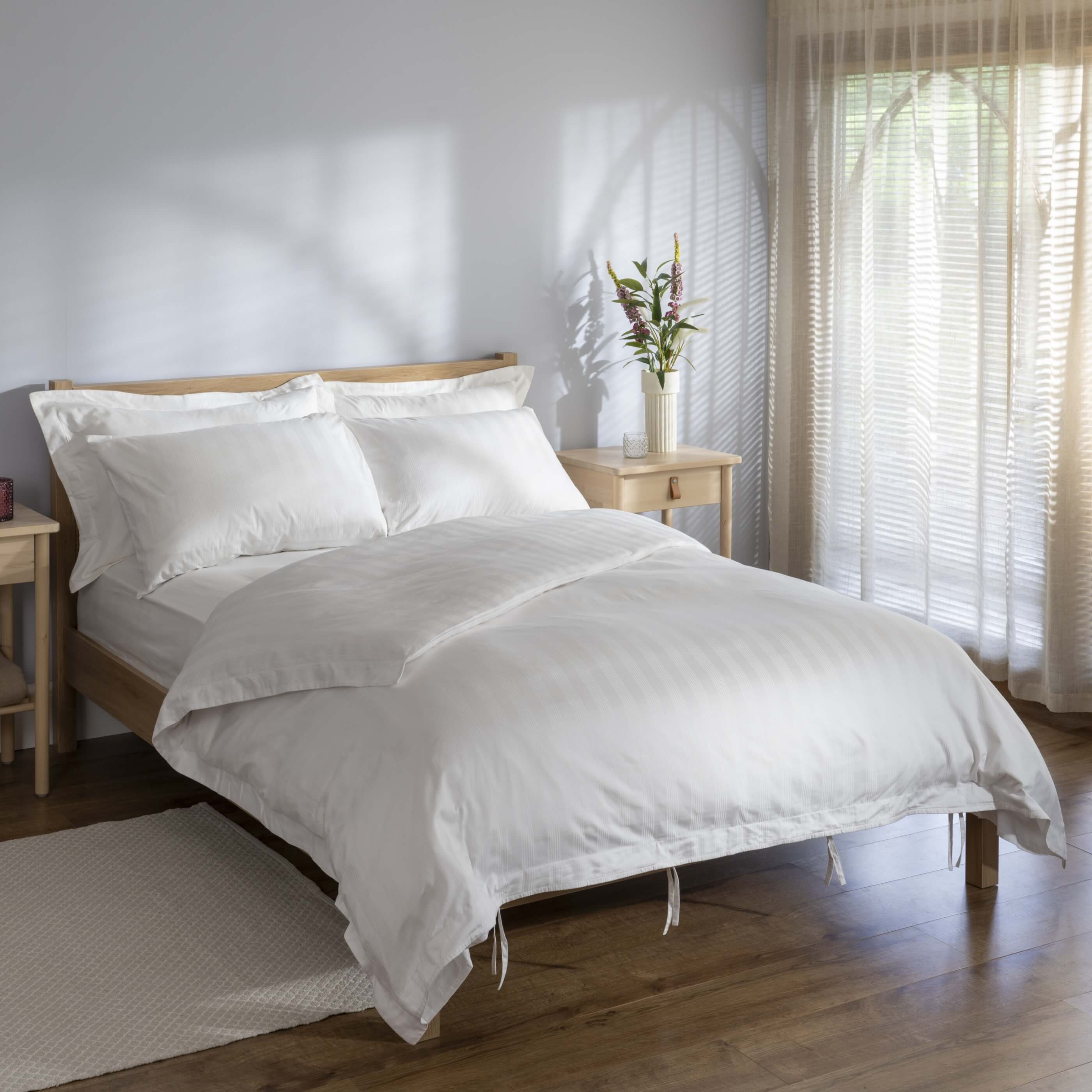 White 400 Thread Count Cotton Stripe Bed Sets styled in a bedroom | Soak and Sleep
