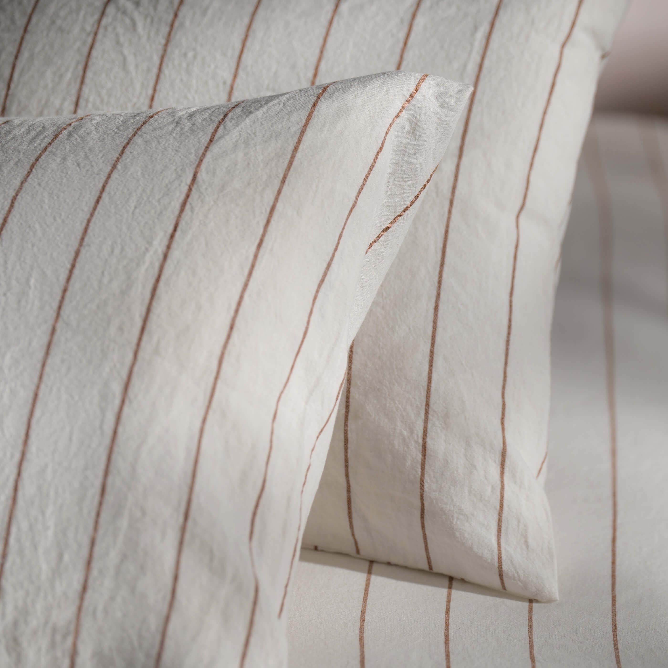 White/Burnt Orange Pinstripe Linen Cotton Blend Bedding bedroom detail | Soak and Sleep