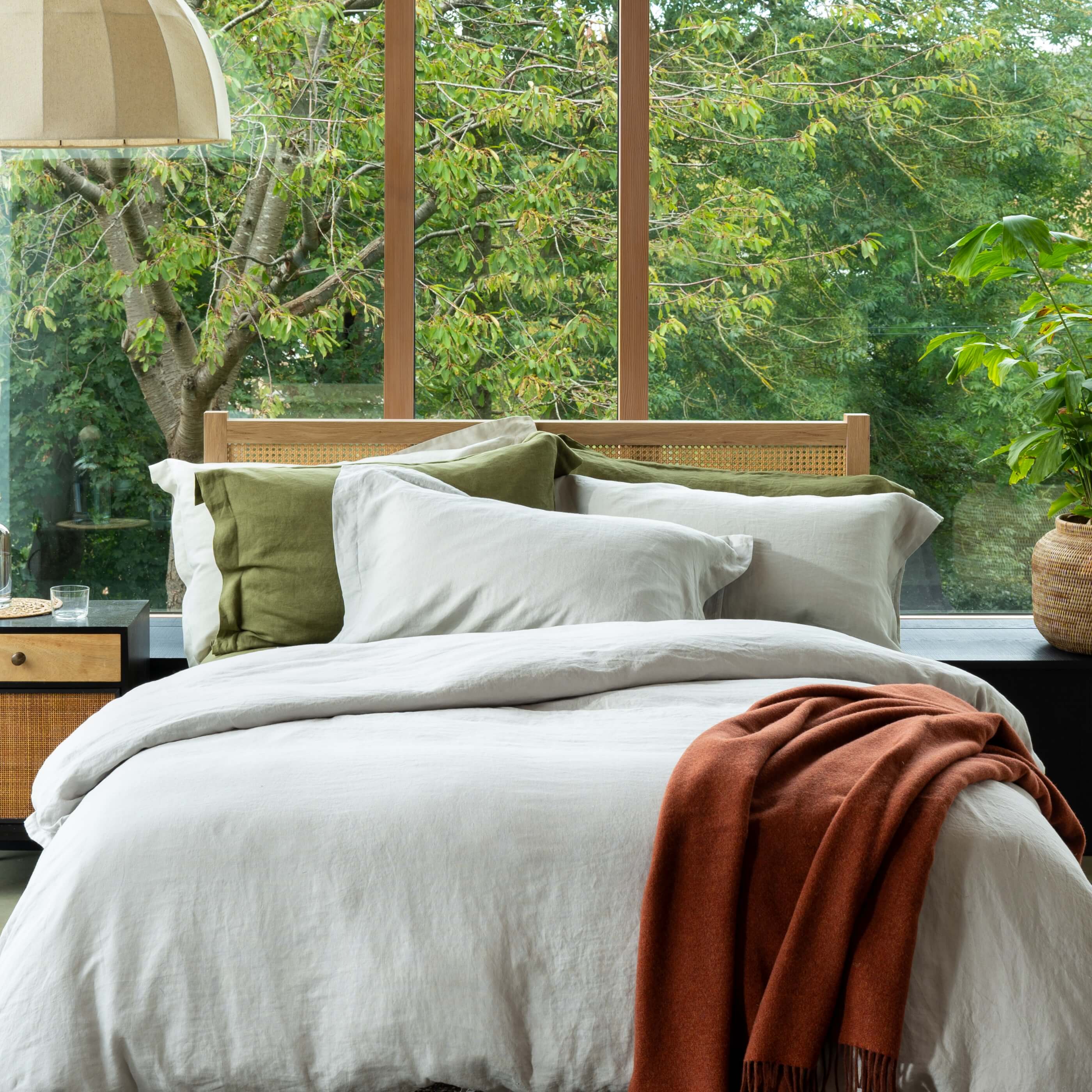 Light Grey French Linen Pillowcases styled in a bedroom | Soak and Sleep