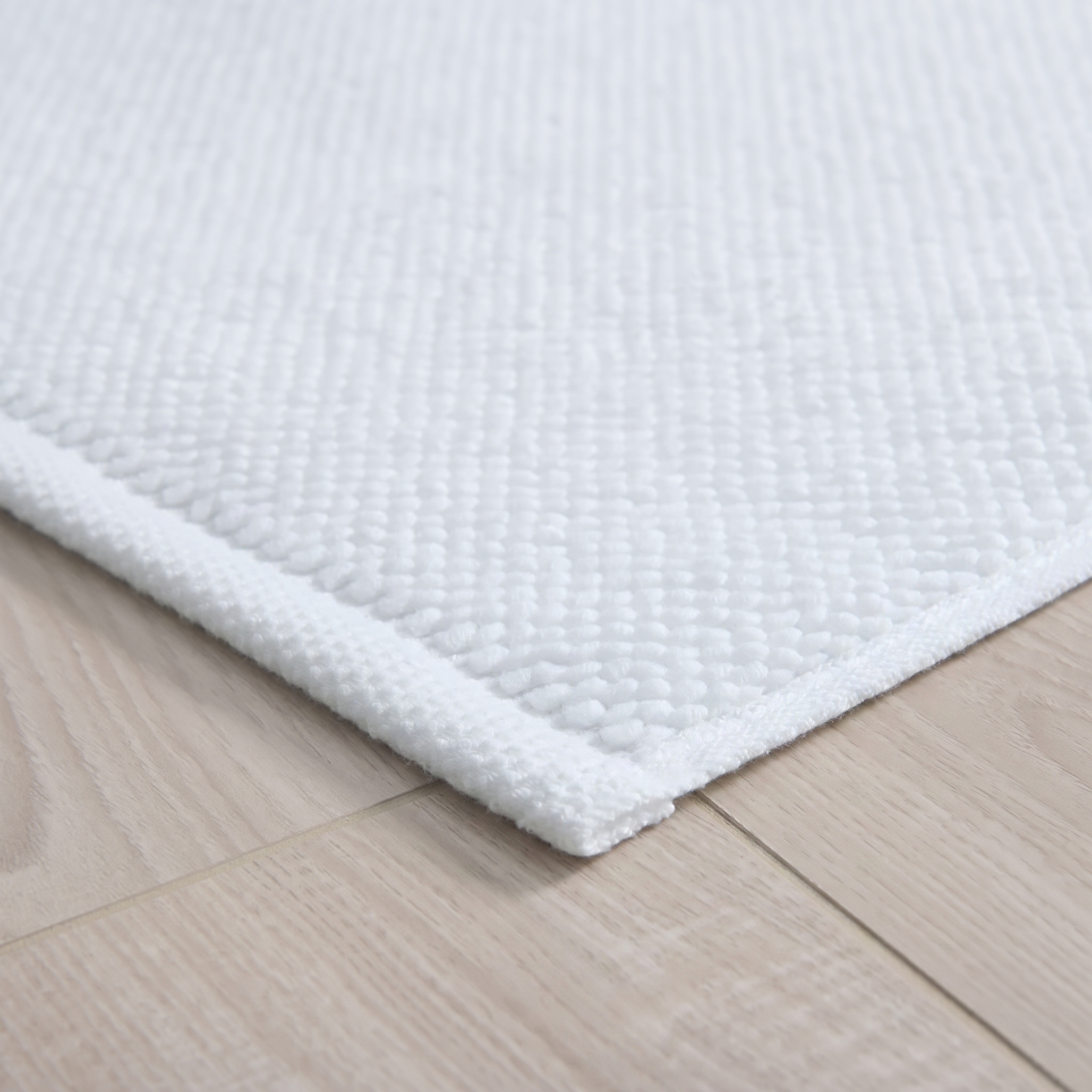 White Textured Cotton Bath Mat styled in a bedroom 2 | Soak and Sleep