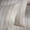 White/Burnt Orange Pinstripe Linen Cotton Pillowcases bedroom detail | Soak and Sleep