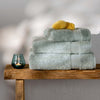Mineral Blue Egyptian Cotton Bath Towels styled in a bedroom | Soak and Sleep