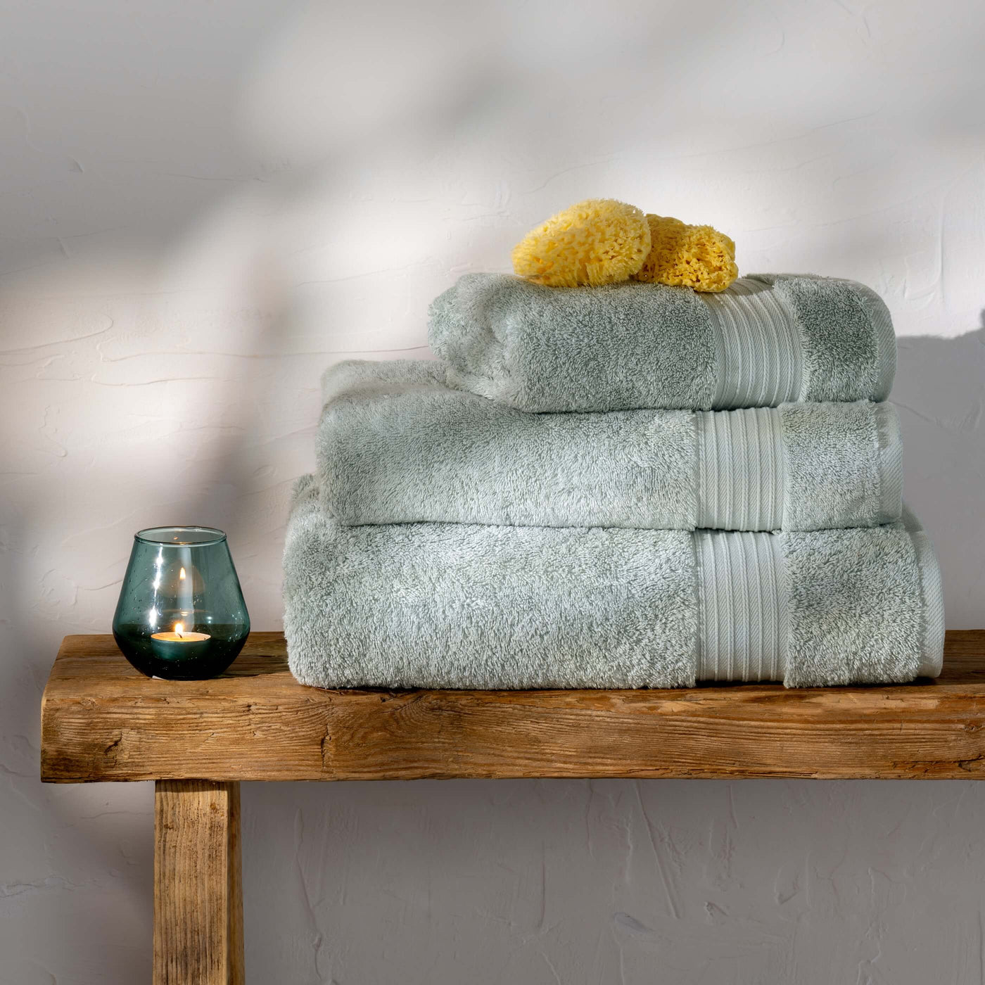 Mineral Blue Egyptian Cotton Bath Sheet styled in a bedroom | Soak and Sleep