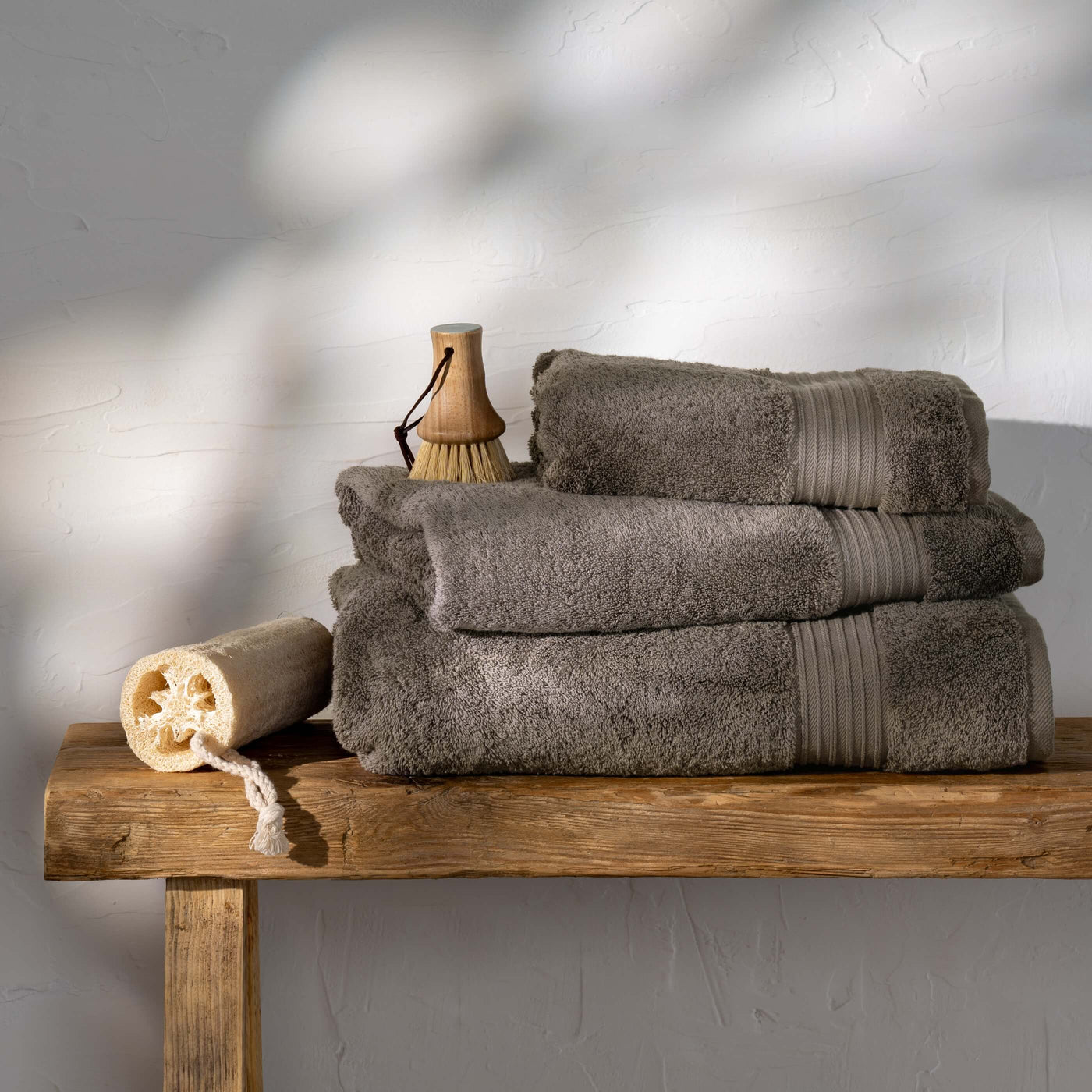 Mink Egyptian Cotton Towels styled in a bedroom | Soak and Sleep