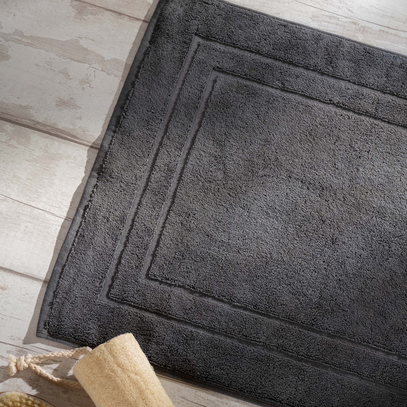 Smoke Egyptian Cotton Bath Mat styled in a bedroom | Soak and Sleep