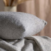 Light Grey Herringbone Pure Wool Cushion styled in a bedroom 1 | Soak and Sleep