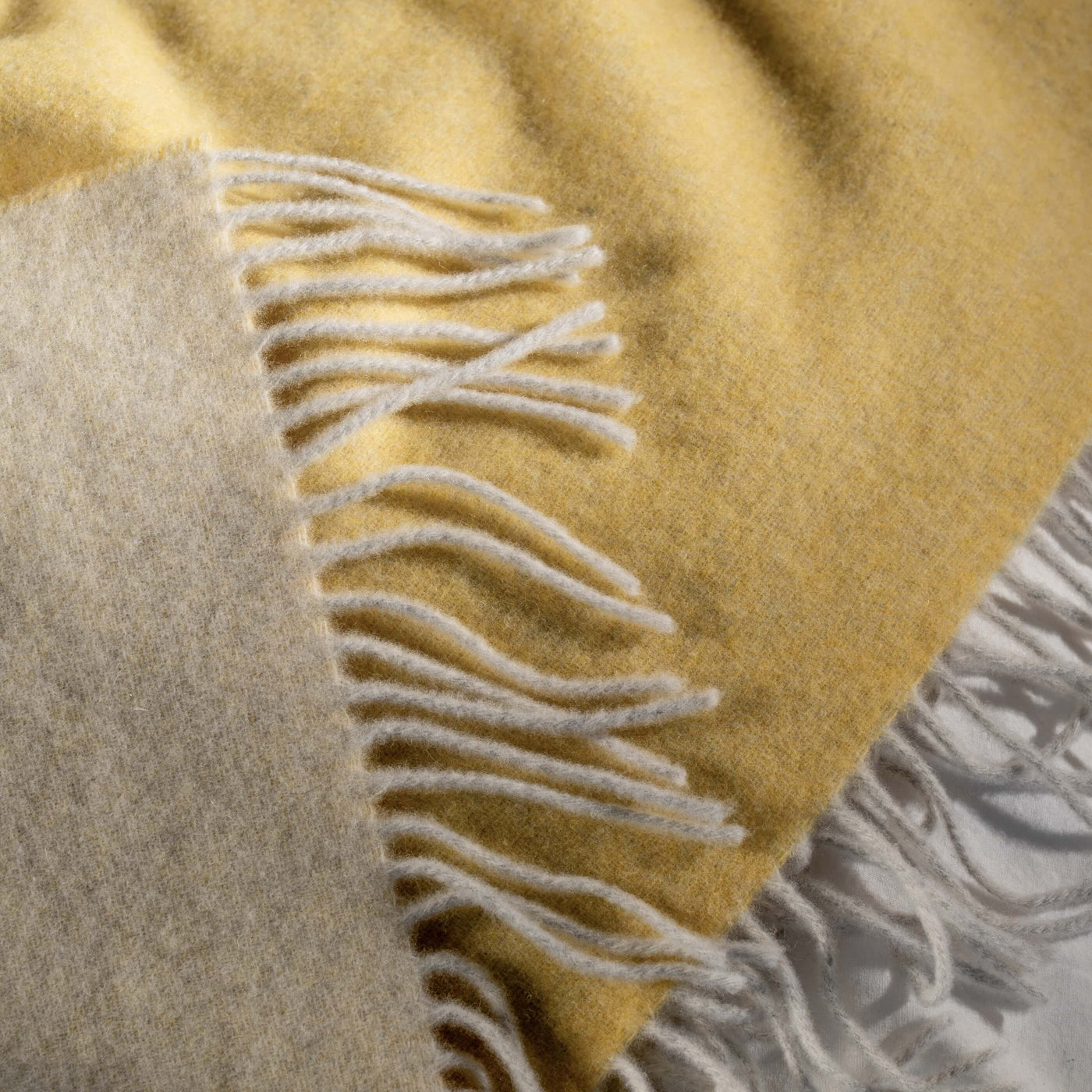 Lemon Yellow Luxury Wool with Cashmere Throw styled in a bedroom | Soak and Sleep