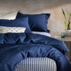 Mediterranean Blue French Linen Bedding and Bed Sheets styled in a bedroom | Soak and Sleep