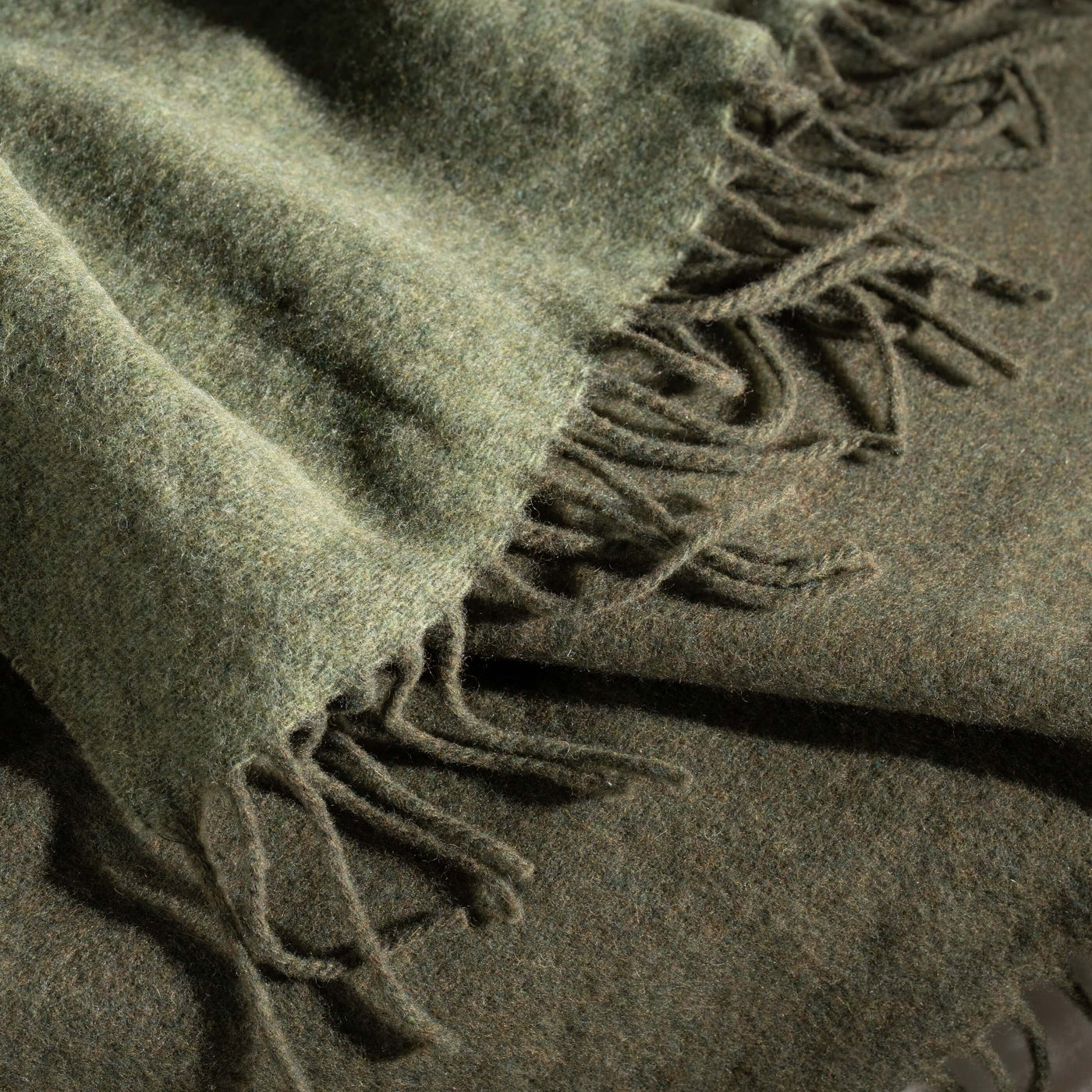 Olive Green Luxury Wool with Cashmere Throw styled in a bedroom | Soak and Sleep