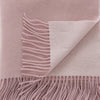 Soft Pink Wool With Cashmere Throw styled in a bedroom | Soak and Sleep