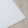 White Textured Cotton Bath Mat styled in a bedroom 1 | Soak and Sleep