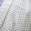 White Waffle Cotton Bedspread styled in a bedroom | Soak and Sleep