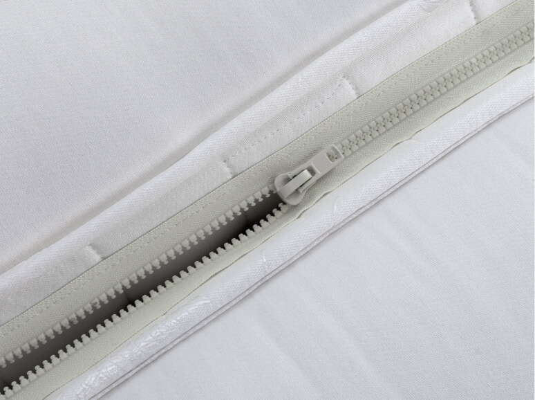 Close up of a zip and link mattress
