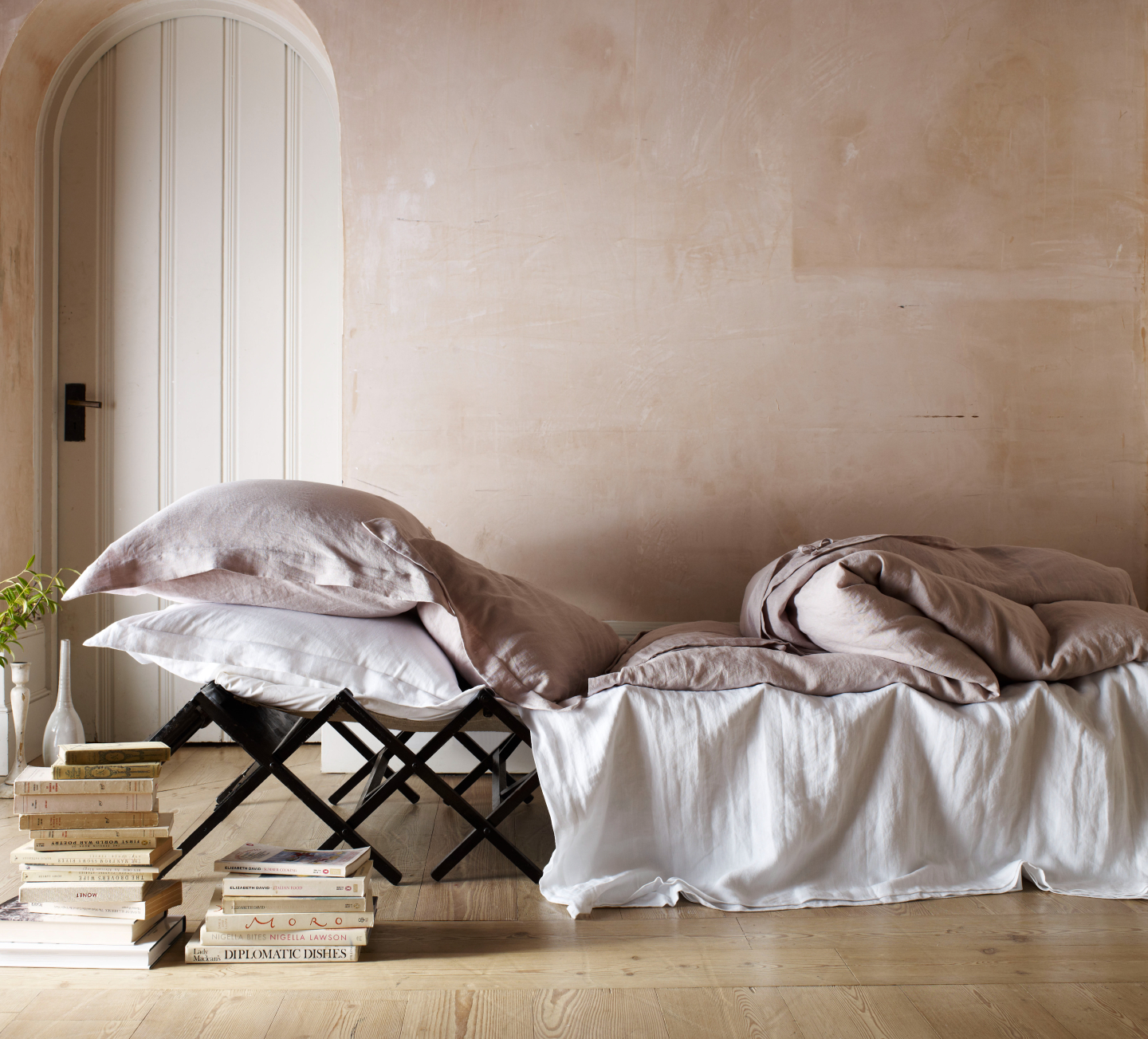 Natural and Blush Soak&Sleep French Linen, styled on a low chic bed