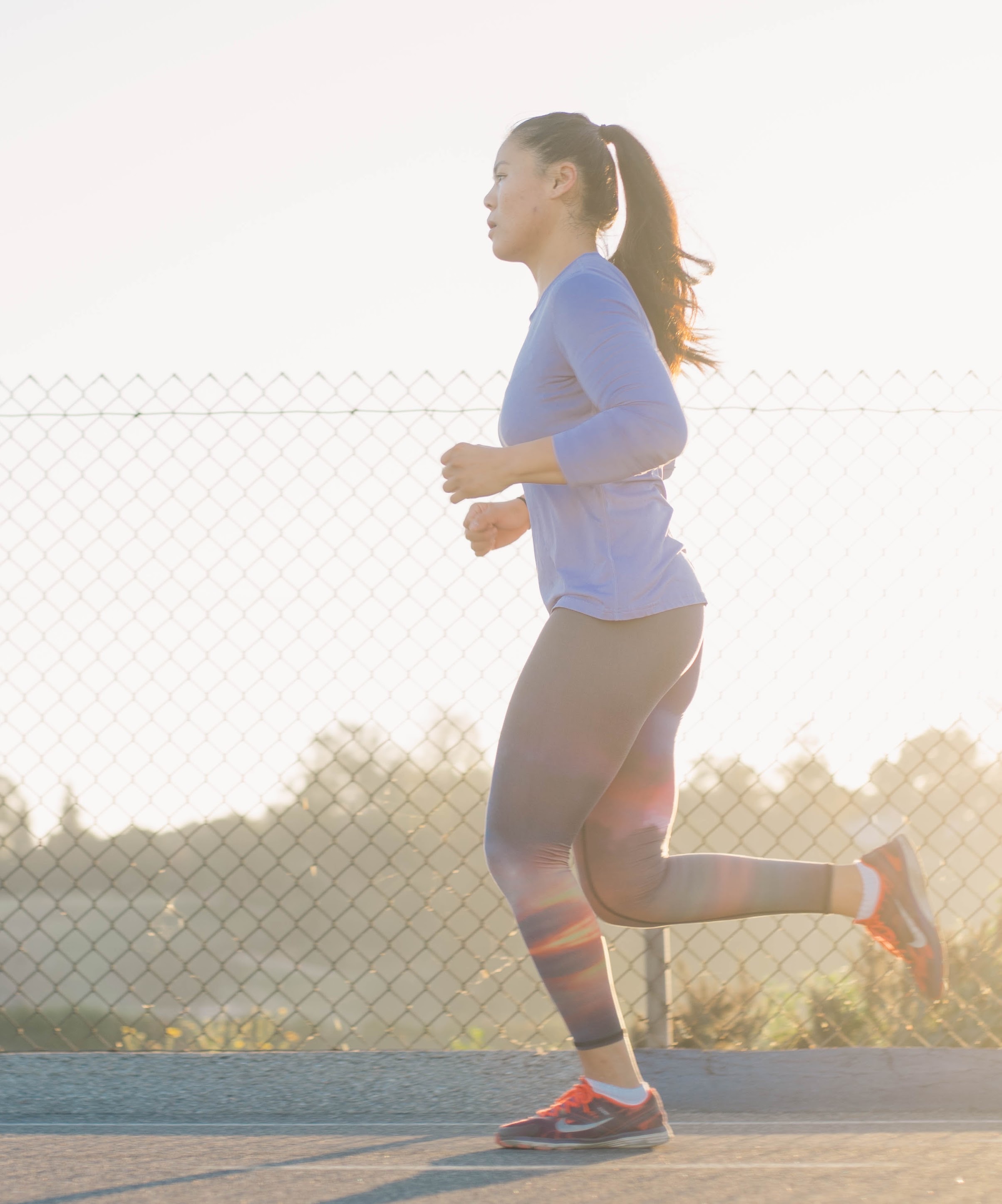Woman running at sunset