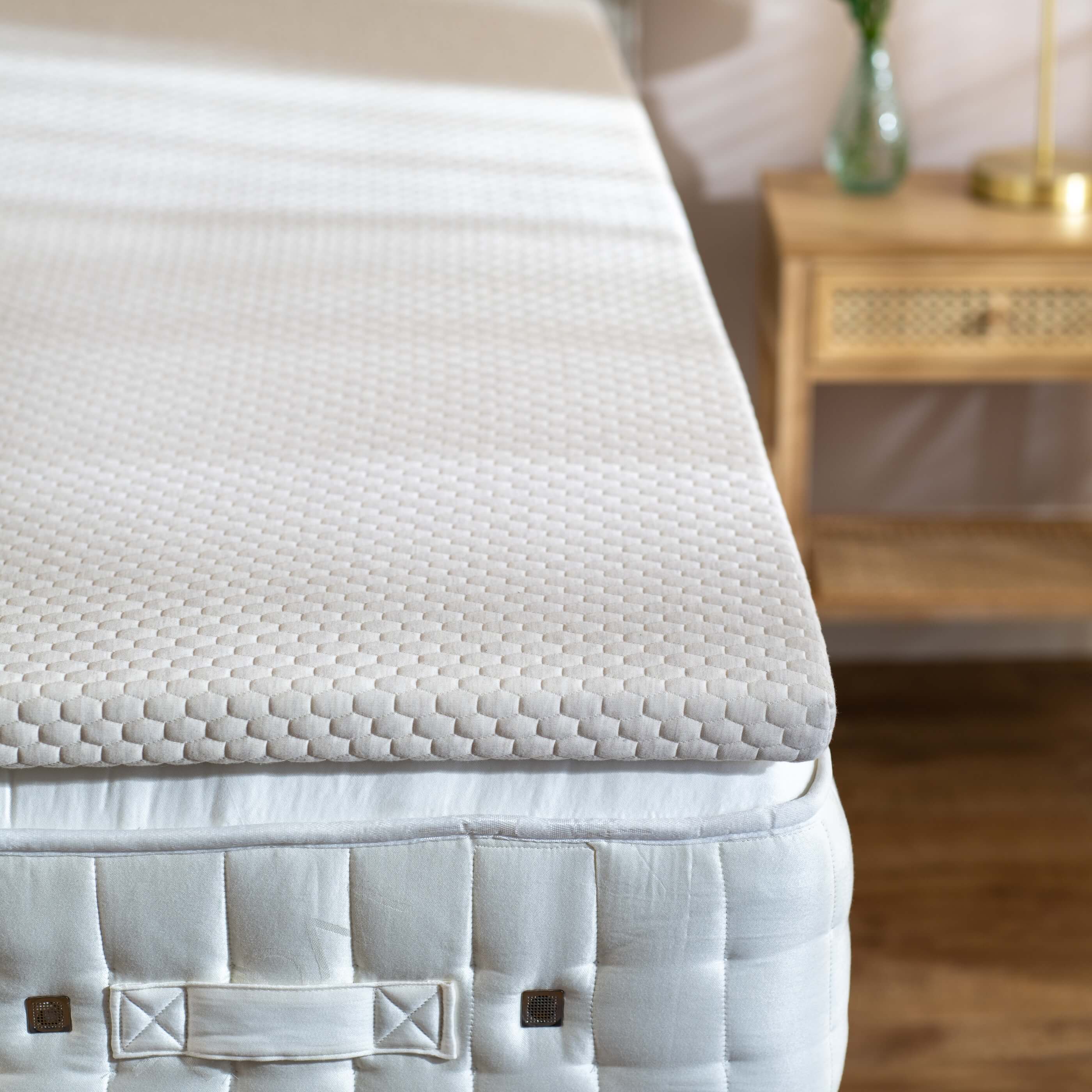 Soak&Sleep Memory Foam Mattress Topper - styled in a bright, fresh bedroom with sunlight beaming through the blinds.