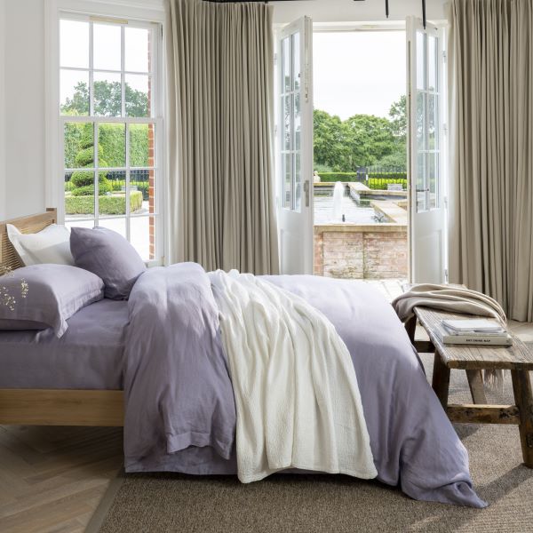 Lavender French Linen Bedding by Soak&Sleep - styled in a fresh, bright bedroom with an outside-in vibe