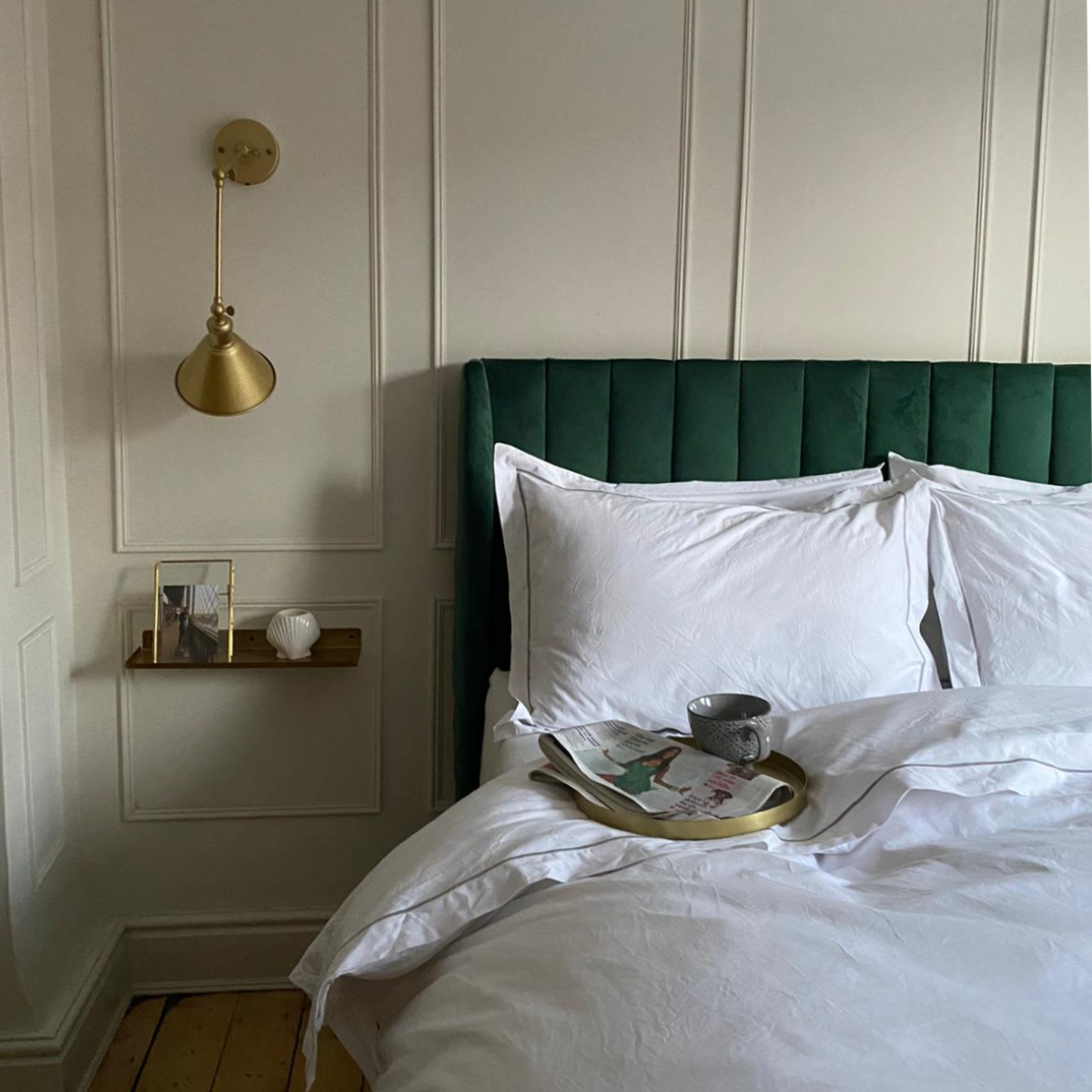 Bottle green headboard with Soak&Sleep pillows and white bedlinen