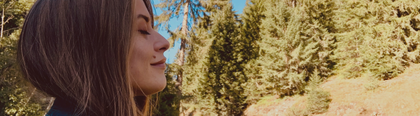 Woman doing breathwork in the outdoors