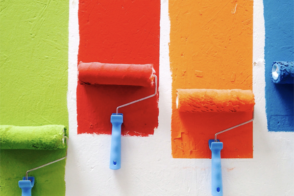 Bright green, red, orange and blue paint strips and rollers