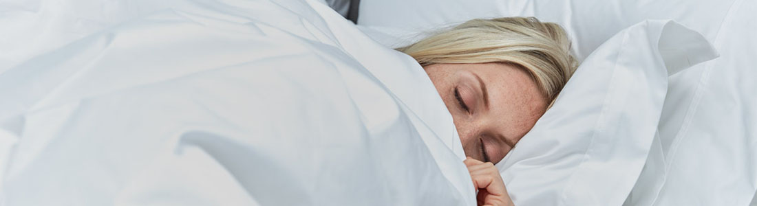 Side-sleeper tucked up in Soak&Sleep bedding