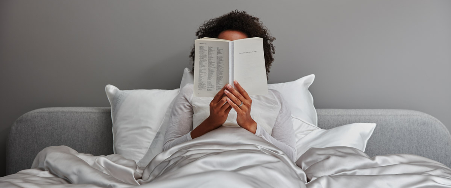 Woman reading in Soak&Sleep Pure Mulberry Silk Bedlinen