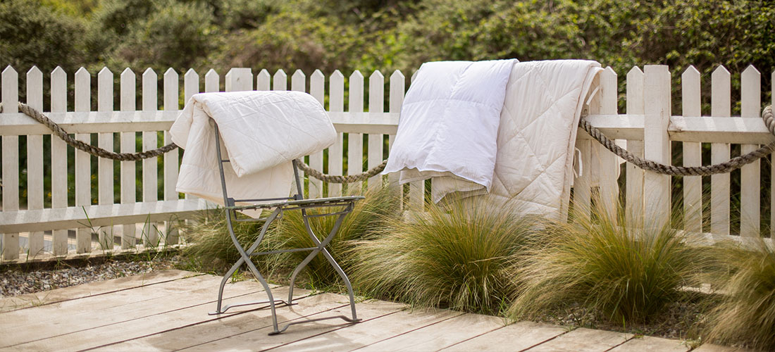 Soak&Sleep summer duvets, hung out on a summer decking