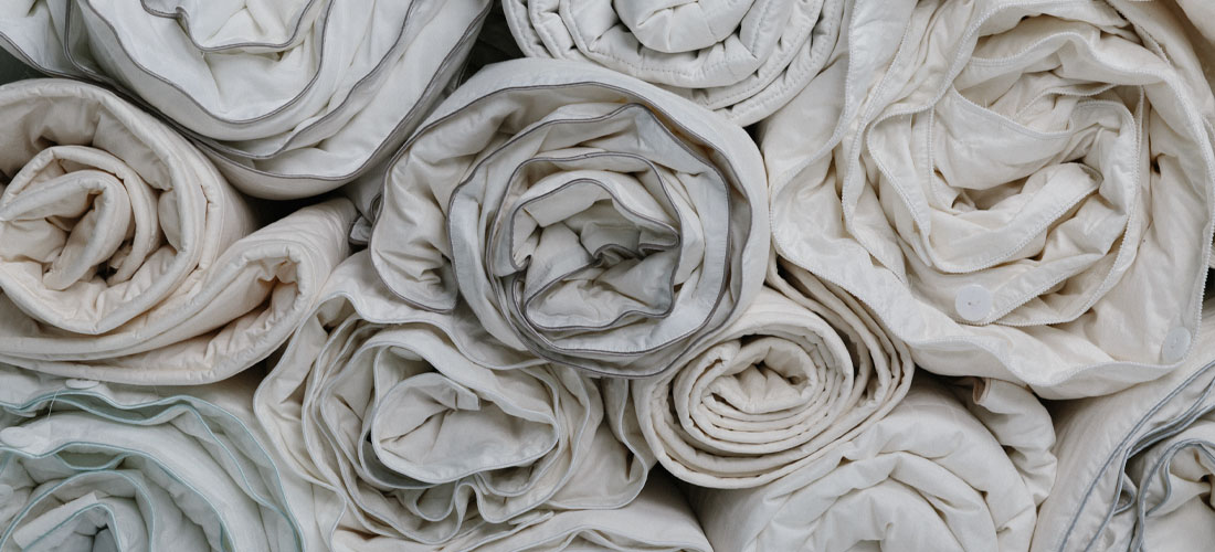 Collection of rolled up Soak&Sleep duvets