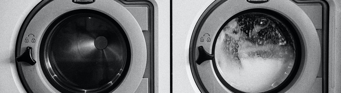 Black and white image of washing machine and dryer